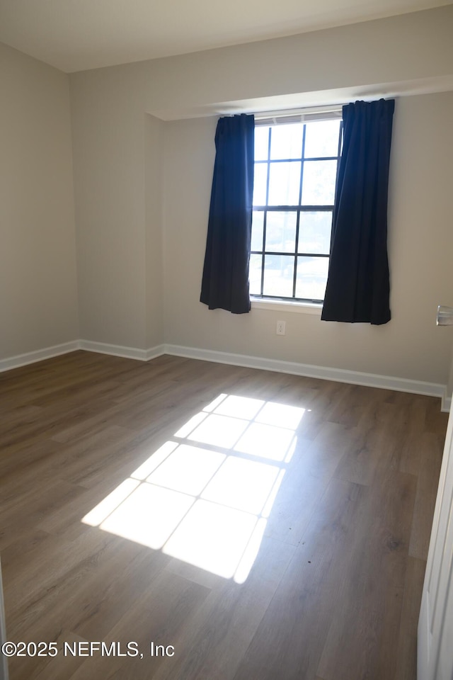 empty room featuring hardwood / wood-style floors