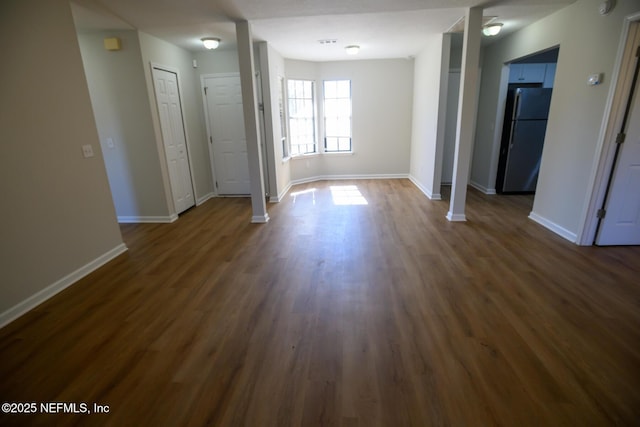 interior space with dark hardwood / wood-style flooring