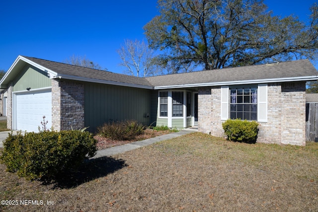 ranch-style house featuring a garage and a front lawn