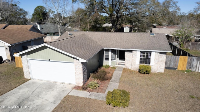 ranch-style home featuring a garage and a front yard