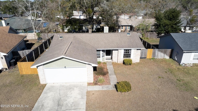 view of front of home featuring a garage and a front yard