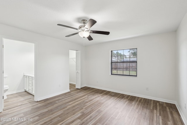 spare room with ceiling fan and light hardwood / wood-style floors