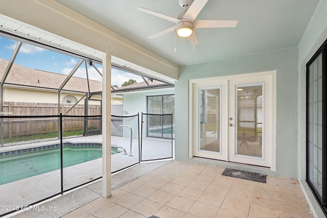 view of pool featuring a patio area, ceiling fan, a lanai, and french doors