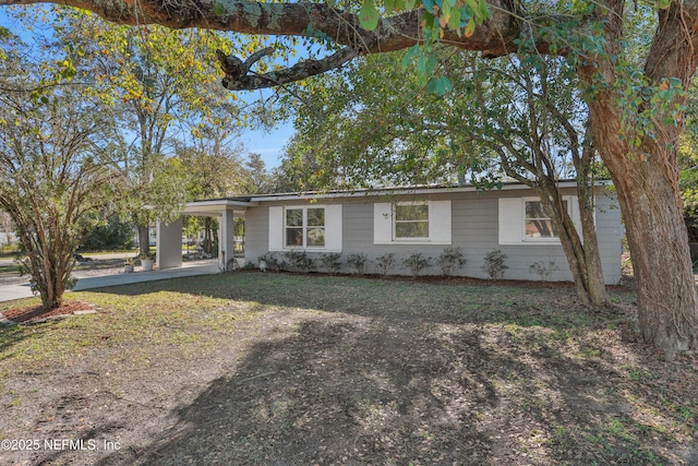 ranch-style home with a carport