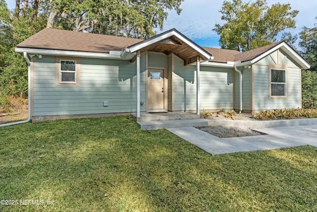 ranch-style house with a front lawn