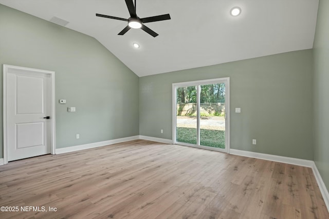 unfurnished room with lofted ceiling, light hardwood / wood-style floors, and ceiling fan