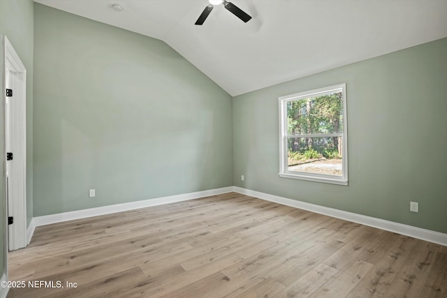 unfurnished room featuring ceiling fan, lofted ceiling, and light hardwood / wood-style floors