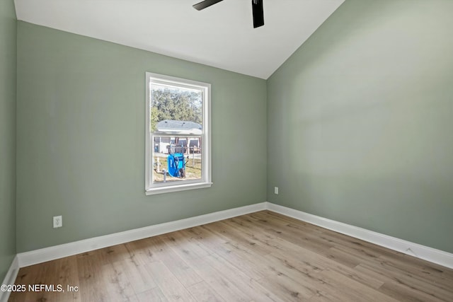 unfurnished room with ceiling fan, lofted ceiling, and light hardwood / wood-style flooring