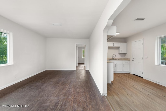 interior space with light hardwood / wood-style floors and sink