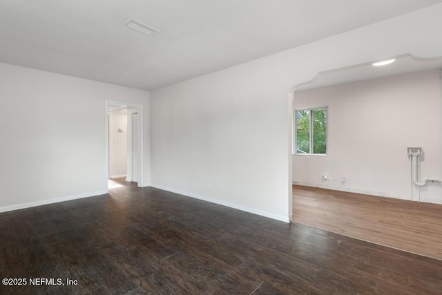 empty room with wood-type flooring