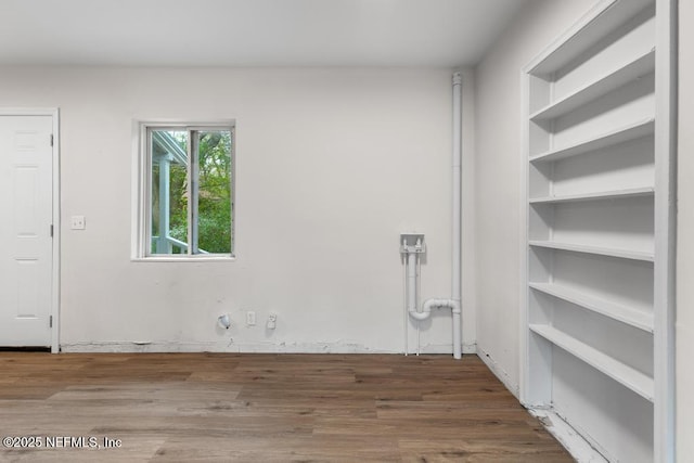 empty room with hardwood / wood-style floors