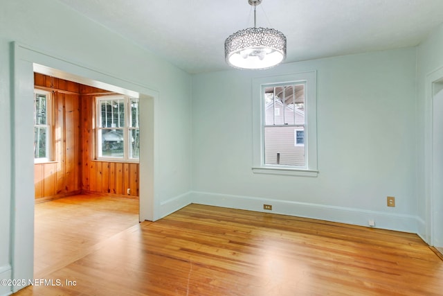 empty room with plenty of natural light and light wood-type flooring