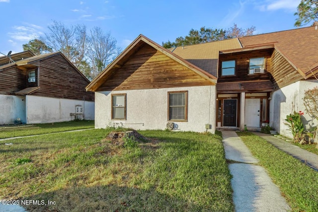 view of front of property with a front lawn