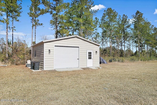 garage featuring a yard