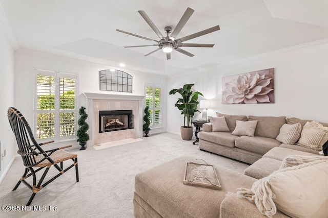 1814 Royal Fern Ln, Fleming Island, FL 32003 - living room featuring carpet floors, ceiling fan, crown molding, a fireplace with flush hearth, and baseboards