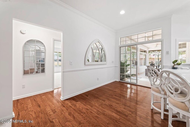 1814 Royal Fern Ln, Fleming Island, FL 32003 - dining space with crown molding, wood finished floors, baseboards, and recessed lighting