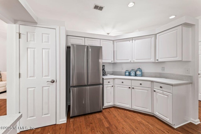 1814 Royal Fern Ln, Fleming Island, FL 32003 - kitchen with freestanding refrigerator, light countertops, dark wood-type flooring, white cabinets, and recessed lighting
