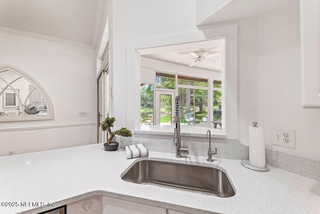 1814 Royal Fern Ln, Fleming Island, FL 32003 - kitchen featuring a sink, light stone countertops, and ceiling fan