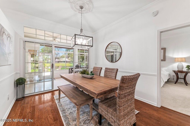 1814 Royal Fern Ln, Fleming Island, FL 32003 - dining room featuring a chandelier, ornamental molding, wood finished floors, and baseboards