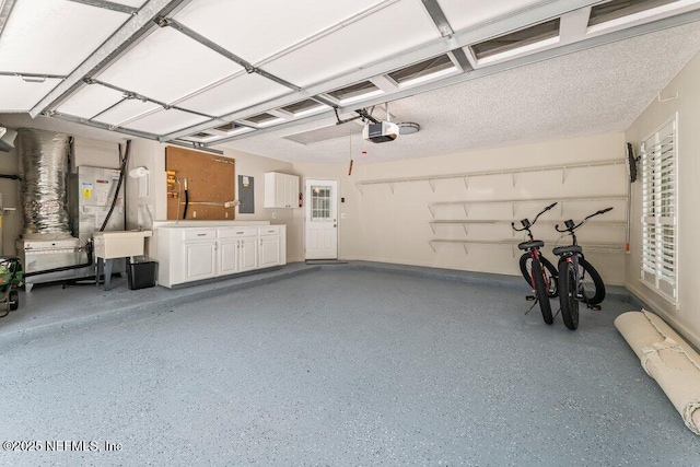 1814 Royal Fern Ln, Fleming Island, FL 32003 - garage featuring a garage door opener and electric panel