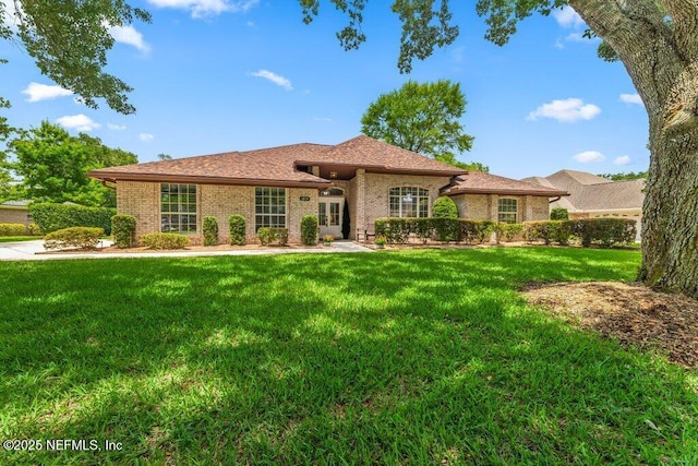 1814 Royal Fern Ln, Fleming Island, FL 32003 - ranch-style home featuring french doors, a front lawn, and brick siding