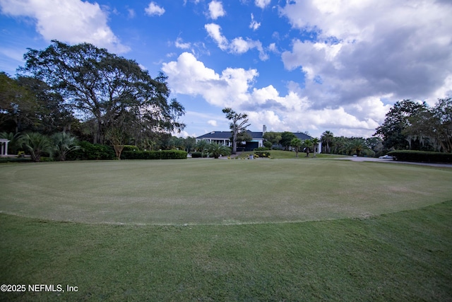 view of home's community featuring a lawn