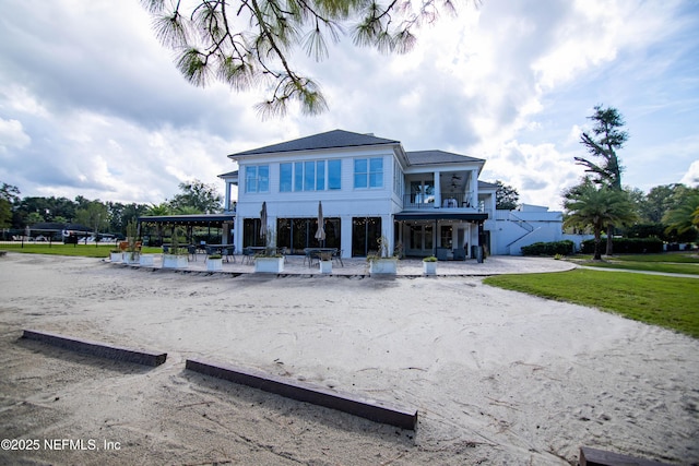 view of front of property with a balcony