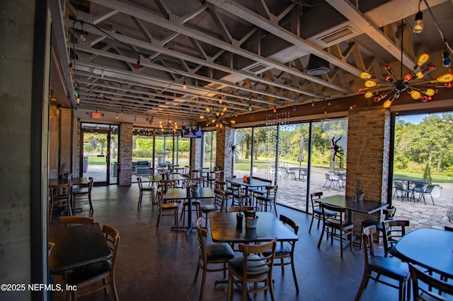 dining space with visible vents and concrete floors