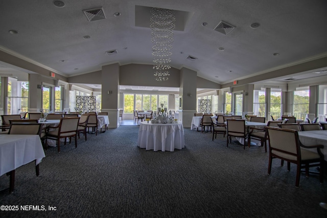 interior space featuring dark colored carpet, visible vents, crown molding, and lofted ceiling