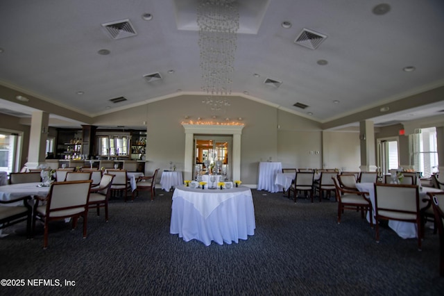 interior space featuring carpet, visible vents, crown molding, and lofted ceiling