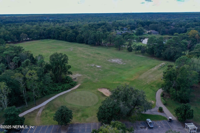 birds eye view of property with a forest view