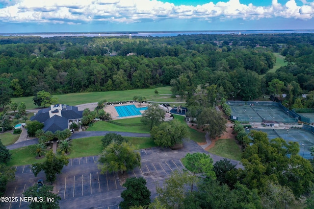 birds eye view of property with a forest view