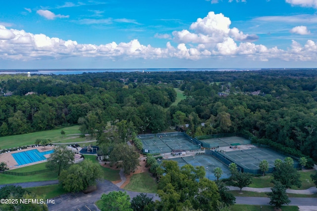 drone / aerial view featuring a view of trees