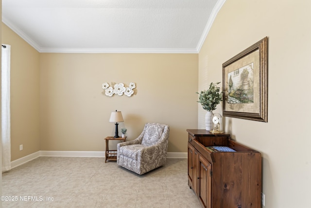 living area featuring ornamental molding, light tile patterned flooring, and baseboards