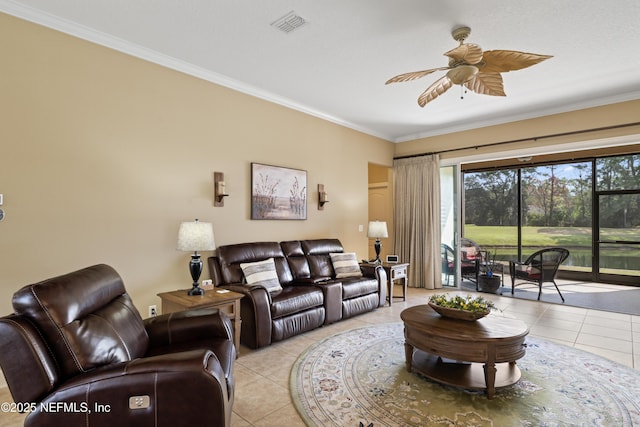 living room featuring ceiling fan, ornamental molding, and light tile patterned floors