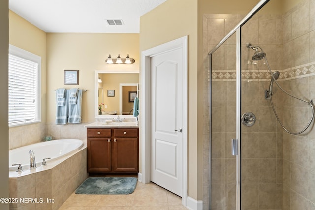 full bath featuring a garden tub, visible vents, a stall shower, vanity, and tile patterned floors