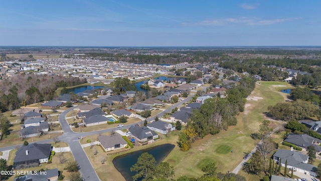 drone / aerial view featuring a water view and a residential view