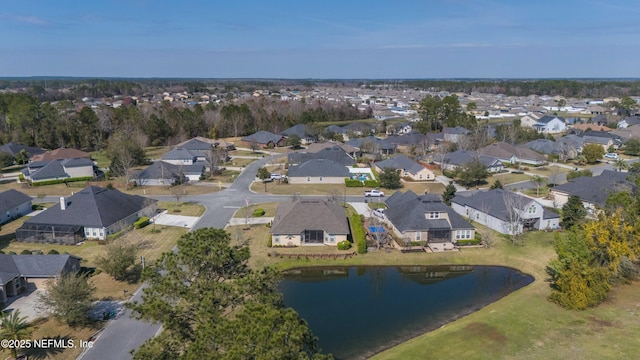 bird's eye view with a water view and a residential view