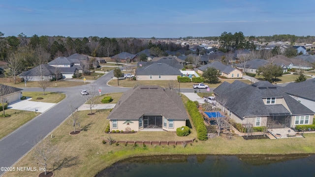 bird's eye view featuring a residential view and a water view