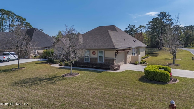 view of front of home featuring a garage, concrete driveway, stone siding, stucco siding, and a front yard