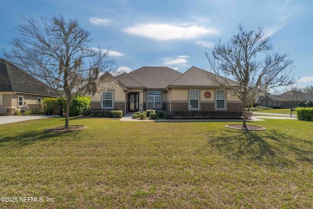 view of front of property featuring driveway, stone siding, a front lawn, and stucco siding