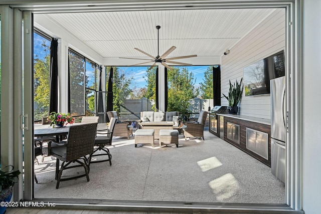 sunroom / solarium with ceiling fan and plenty of natural light