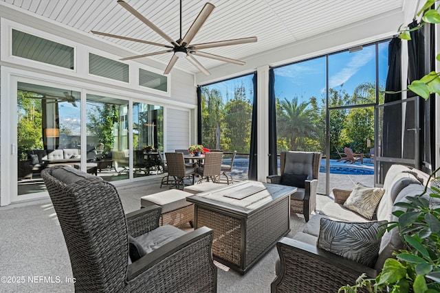 sunroom with ceiling fan and a healthy amount of sunlight