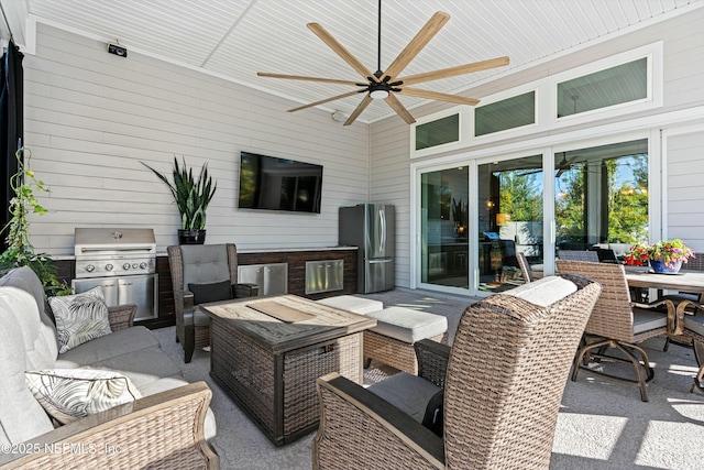 view of patio with grilling area, ceiling fan, and an outdoor hangout area