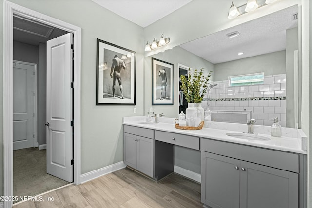 bathroom with walk in shower and vanity