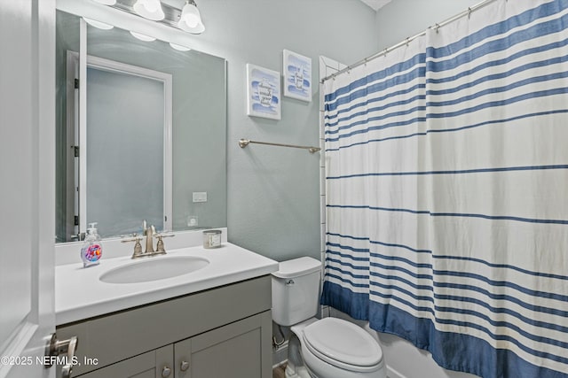 full bathroom with shower / bathtub combination with curtain, vanity, and toilet