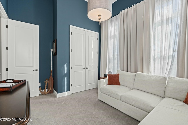 living room featuring carpet floors and plenty of natural light