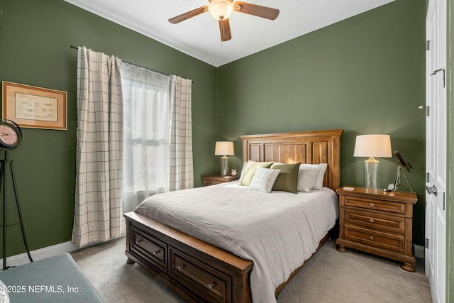 bedroom featuring ceiling fan and light colored carpet