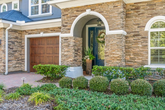 property entrance with a garage