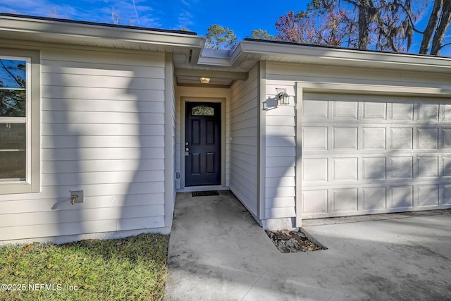 entrance to property featuring a garage